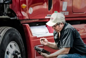 I-40 Mobile Repair technician working on a semi-truck